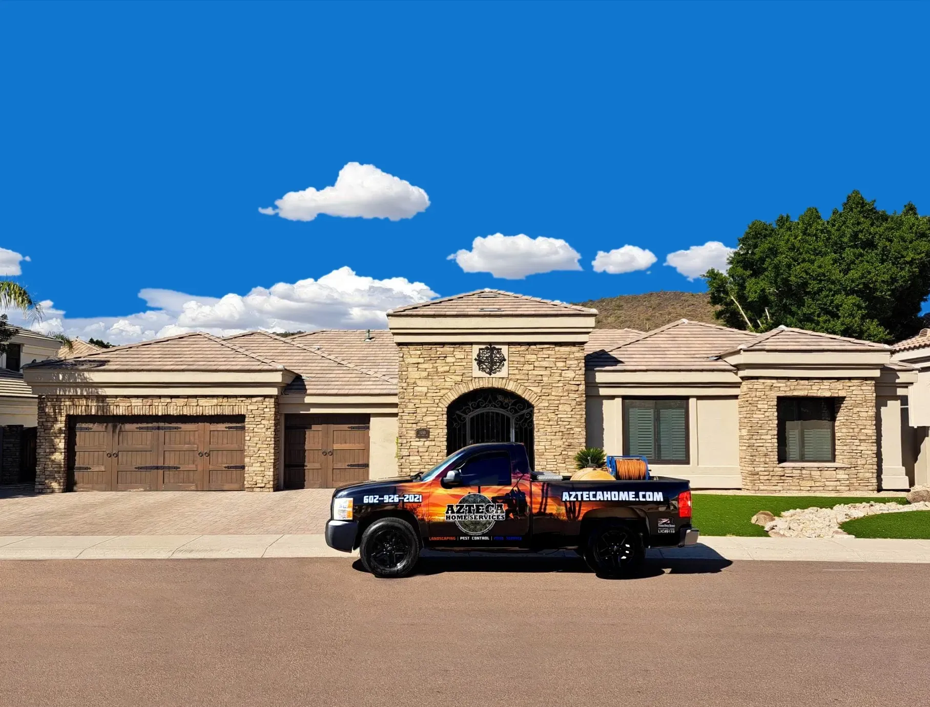 AZTECA Pest Control truck in front of house